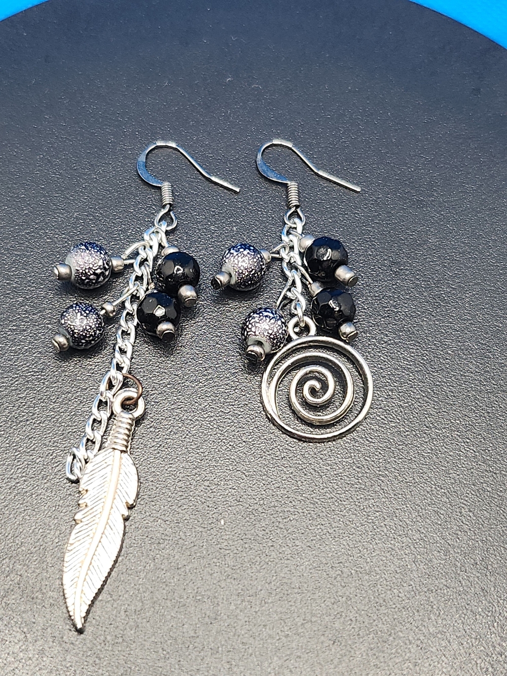 Asymmetrical Black Bead Dangle Earrings with Silver Feather & Spiral Charms